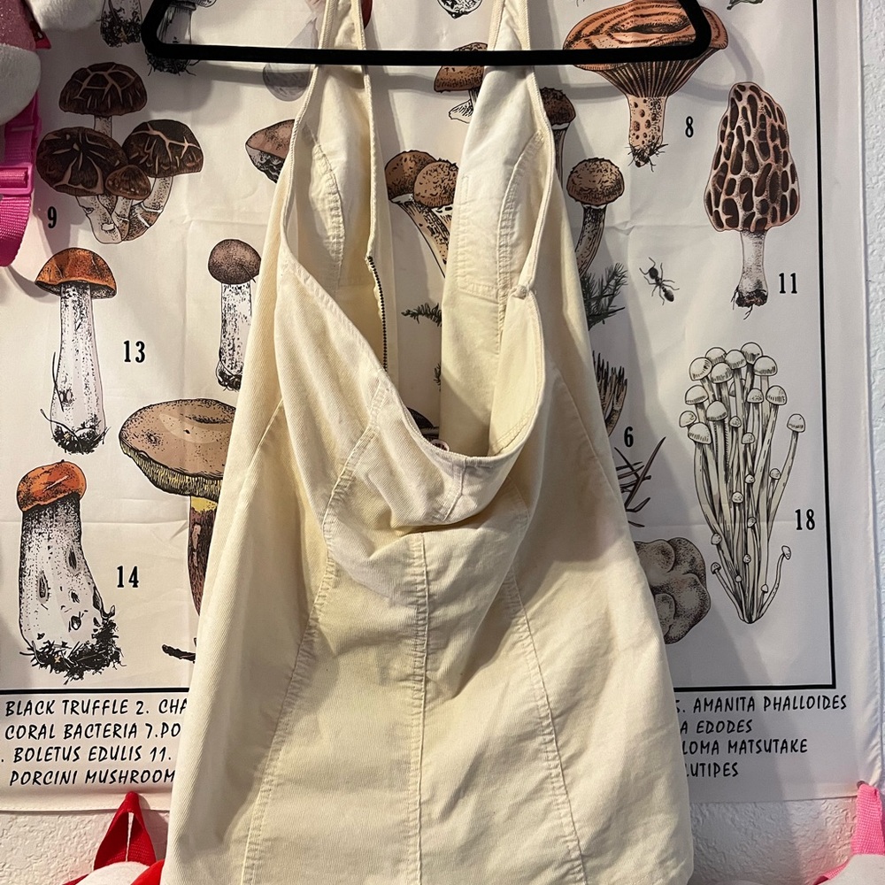 Halter shorts jumpsuit with star keychain zip up in the front. - Picture 7 of 7
